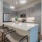 kitchen with an island bar stools