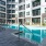 a court yard with a swimming pool and lounge chairs