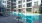 a court yard with a swimming pool and lounge chairs