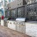 outdoor grilling stations in a courtyard with stone walls