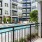 Private apartment patio with a view of the pool area at Legacy Encore